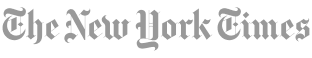 Logo of the new york times in ornate, cursive font on a transparent background.