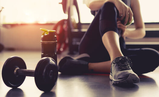 woman resting after exercising at the gym