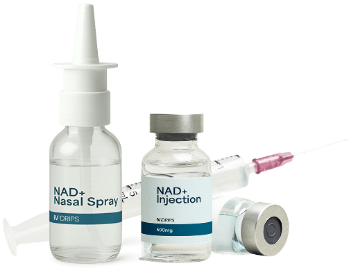 Three medical containers labeled NAD+ Nasal Spray and NAD+ Injection are shown next to a syringe, with a needle cap and a small glass vial, on a white background.