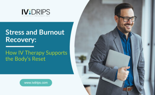 A smiling man in business attire holds a laptop while standing in an office. Text reads: Stress and Burnout Recovery: How IV Therapy Supports the Body’s Reset. IV DRIPS logo is displayed in the corner.