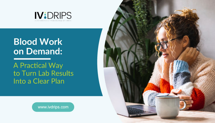 A woman in glasses and a striped sweater sits at a table with a laptop and a mug, reading intently. Text on the image promotes IV Drips blood work on demand for practical lab results planning.