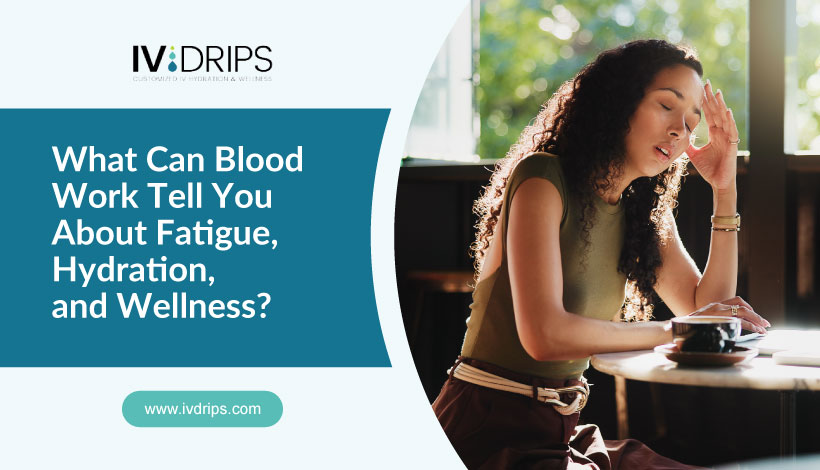 A woman sits at a table, looking fatigued with her hand on her forehead. Text on the image reads: “What Can Blood Work Tell You About Fatigue, Hydration, and Wellness?” and a website link: www.ivdrips.com.
