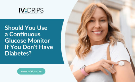 Smiling woman with long blonde hair shows her arm with a glucose monitor attached. Text reads: Should You Use a Continuous Glucose Monitor If You Dont Have Diabetes? and the IV DRIPS logo is visible.